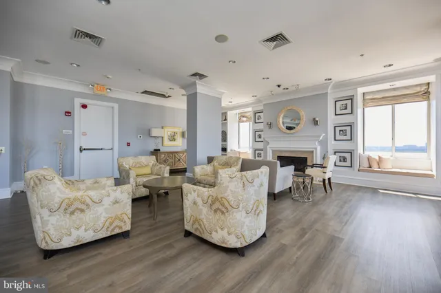 a living room with lots of furniture and white walls