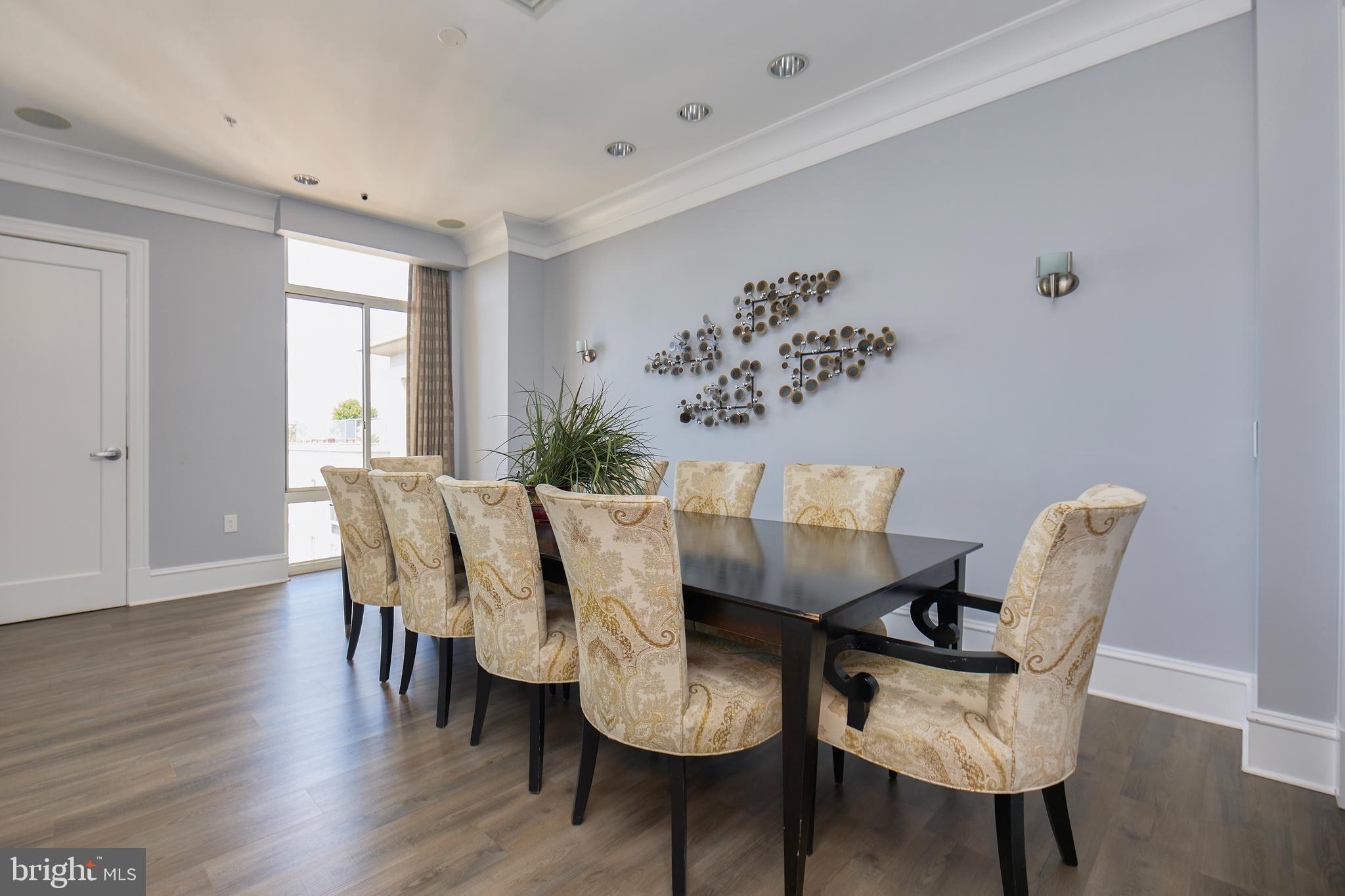 851 North Glebe Road, Unit 1514 Arlington, VA 22203 - Photo 34 of 47 a view of a dining room with furniture and wooden floor