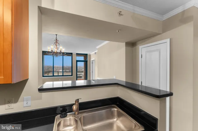 a kitchen with a sink and a window