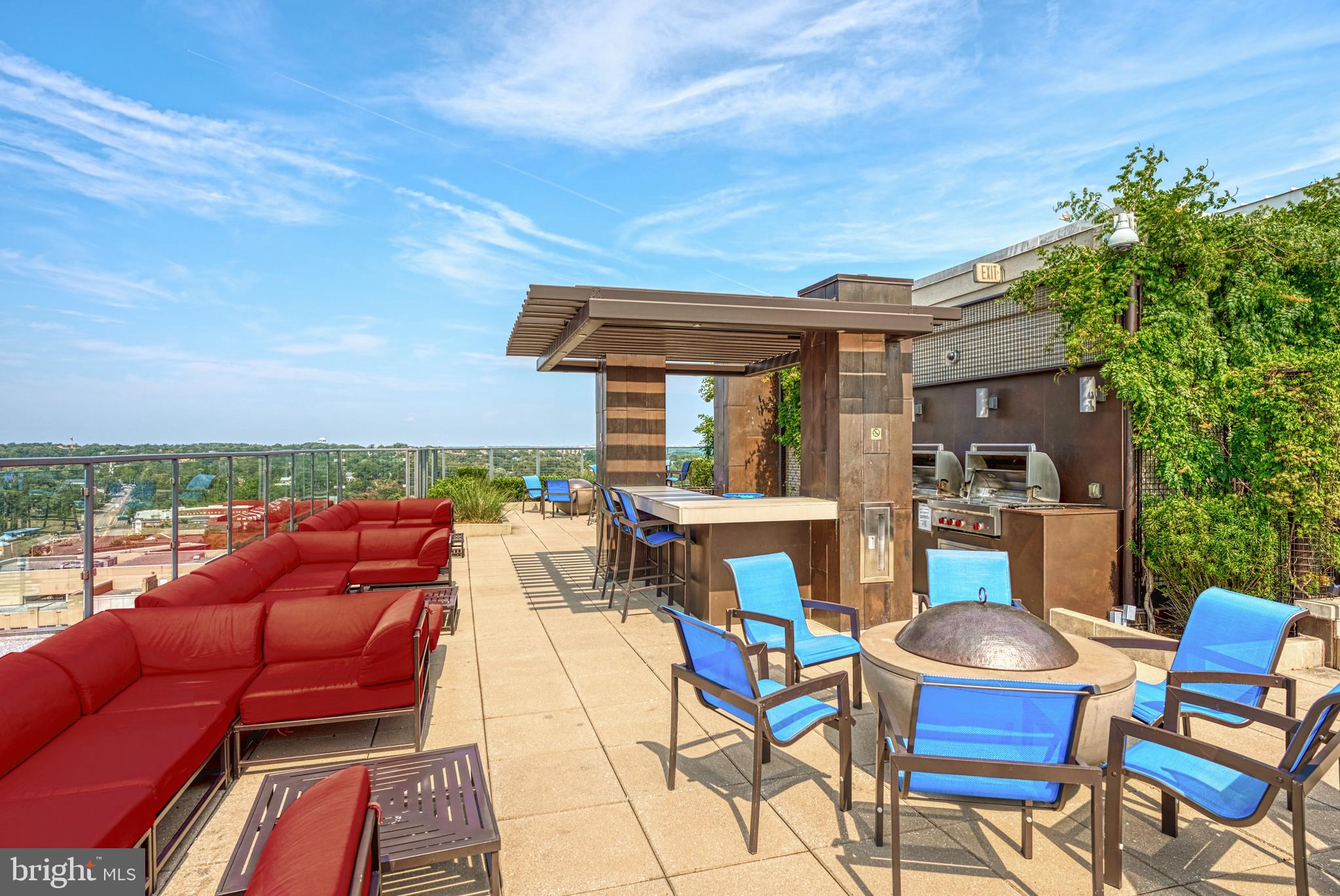 851 North Glebe Road, Unit 1514 Arlington, VA 22203 - Photo 41 of 47 a roof deck with a table and chairs