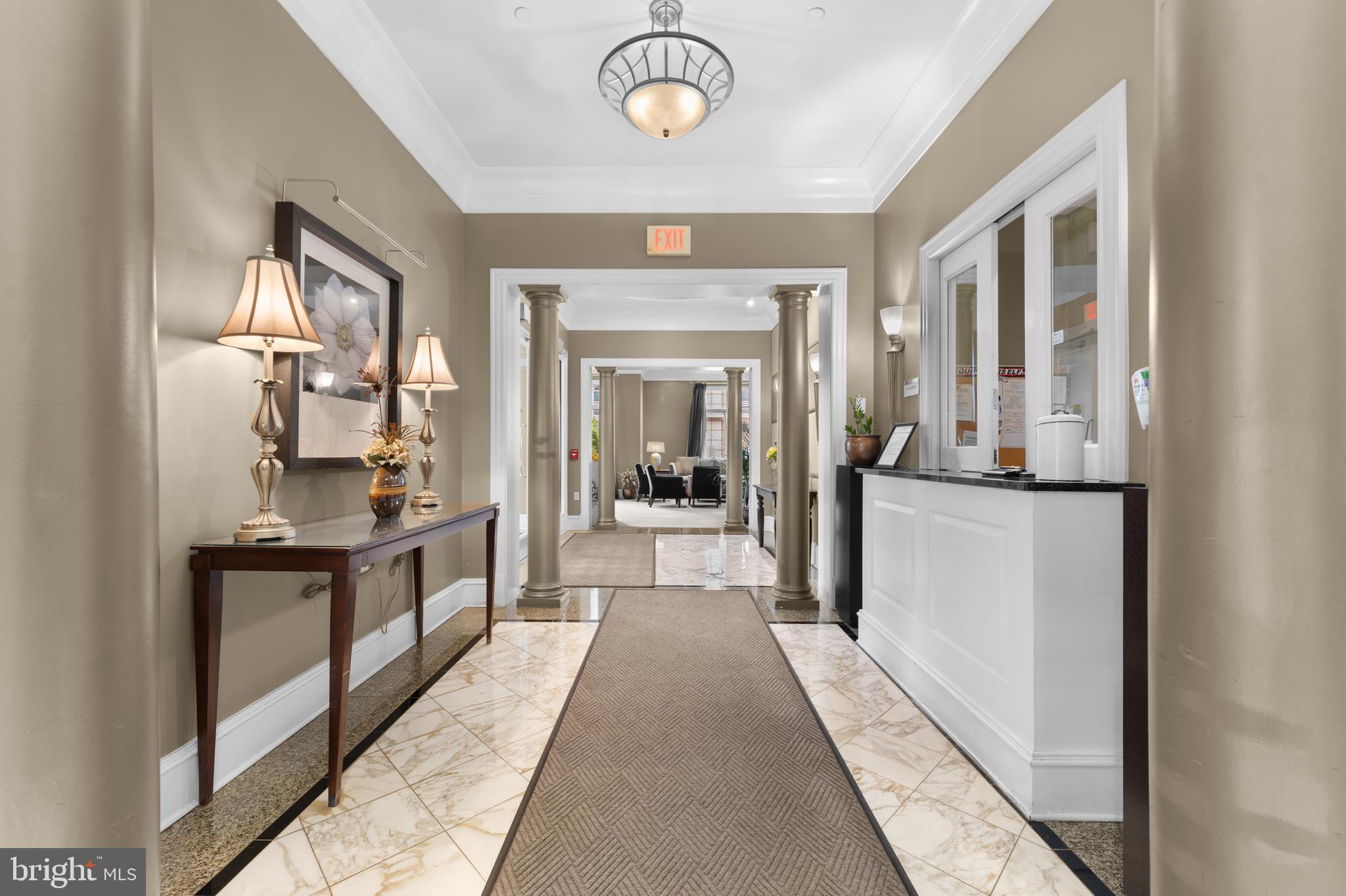 851 North Glebe Road, Unit 1514 Arlington, VA 22203 - Photo 44 of 47 a view of a hallway with wooden floor and a living room