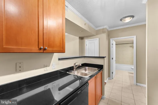 a kitchen that has a sink and cabinets