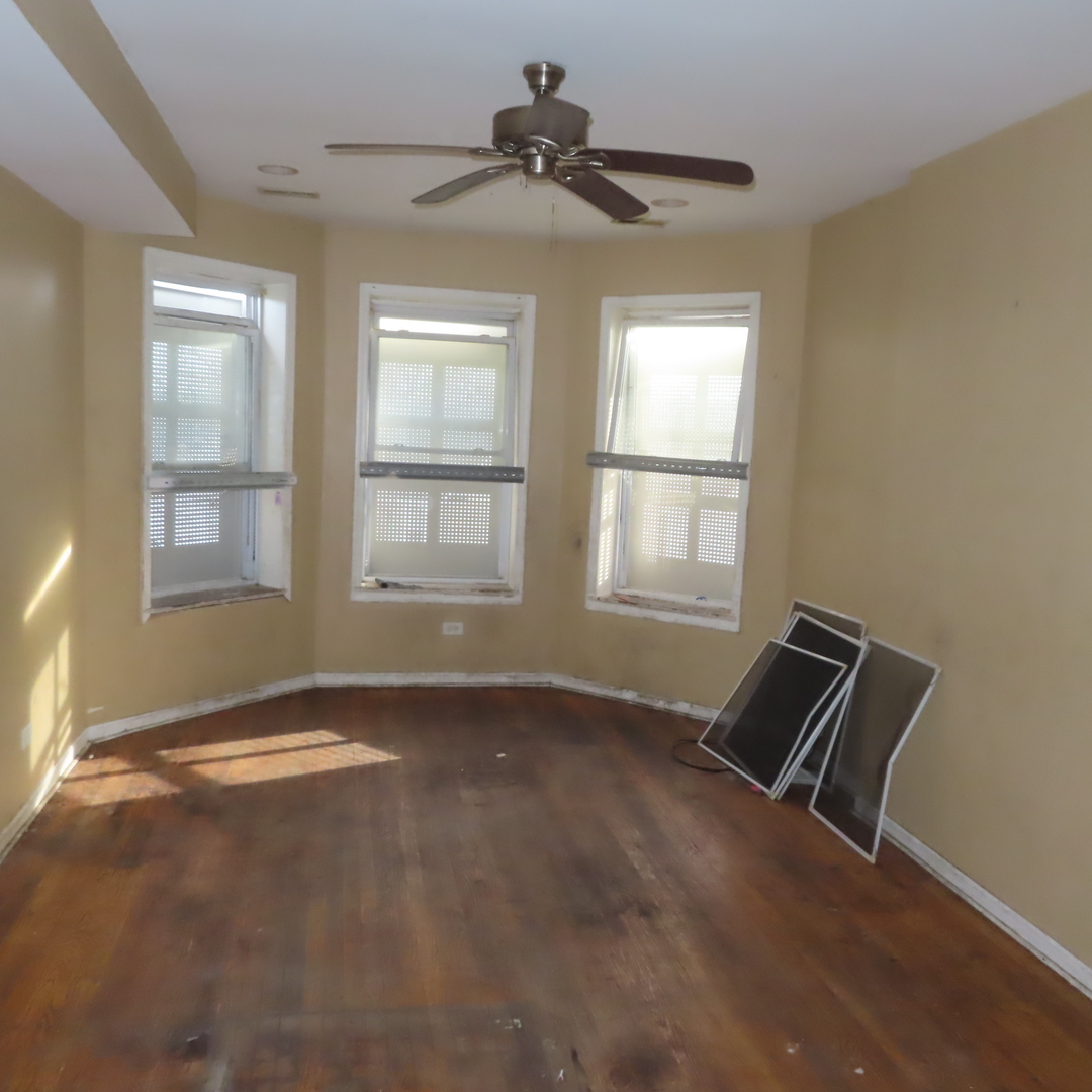 7046 South Normal Boulevard Chicago, IL 60621 - Photo 2 of 41 a view of an empty room with a window