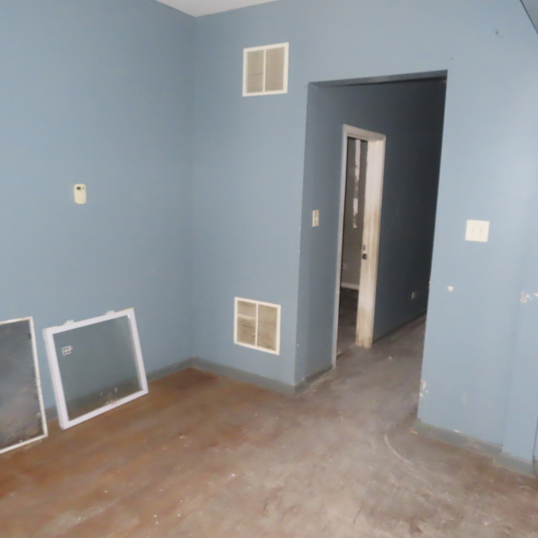 7046 South Normal Boulevard Chicago, IL 60621 - Photo 22 of 41 a view of a livingroom with an empty space and a fireplace