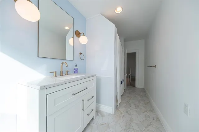 a bathroom with a window and a shower