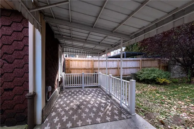 a view of backyard with tree