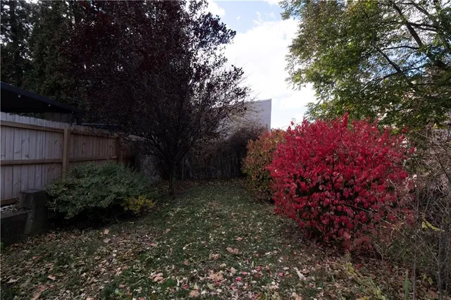 an aerial view of multiple houses with outdoor space