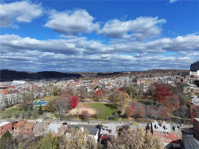 a view of city with tall buildings
