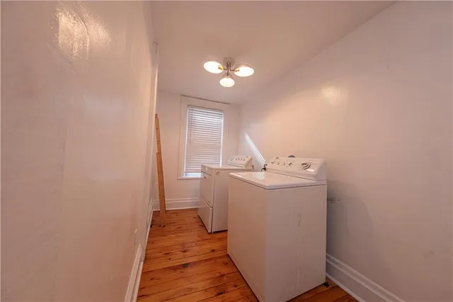a view of a hallway with washer and dryer