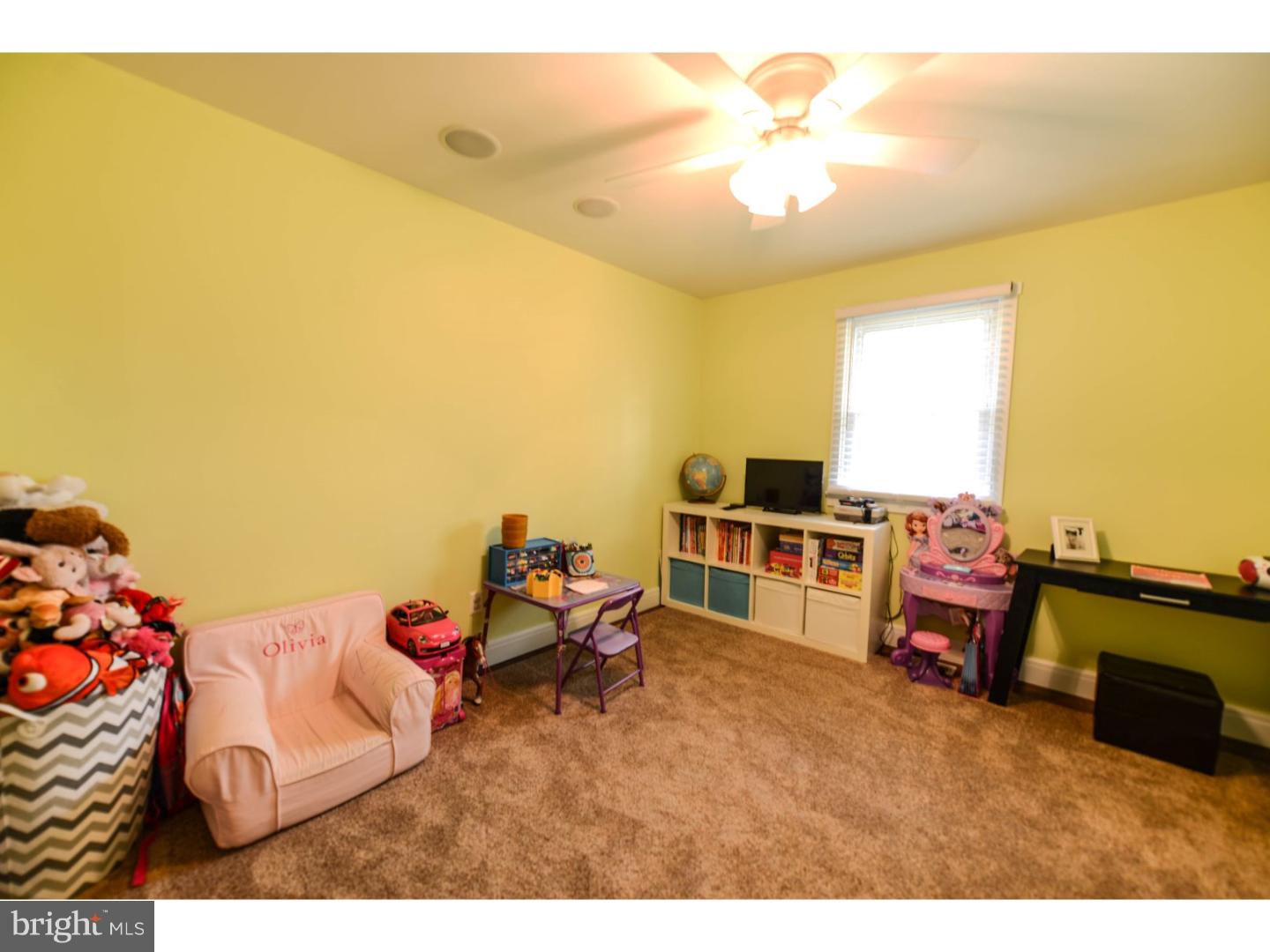 72 Kansas Road Pennsville, NJ 08070 - Photo 13 of 22 a living room with furniture and a flat screen tv