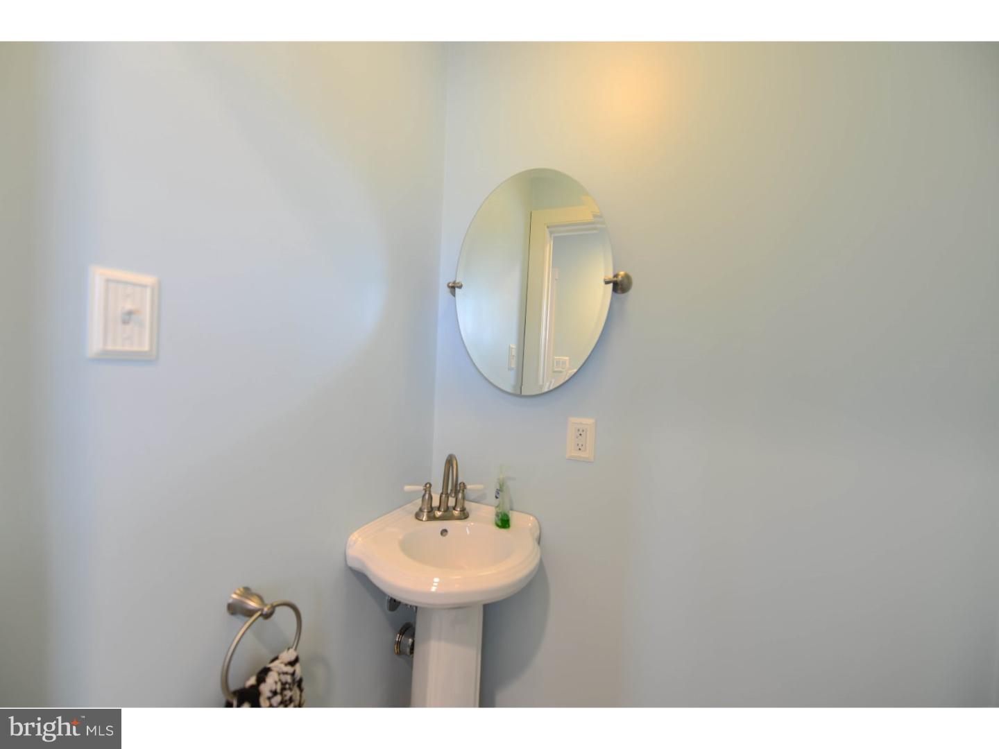 72 Kansas Road Pennsville, NJ 08070 - Photo 14 of 22 a bathroom with a sink and a mirror