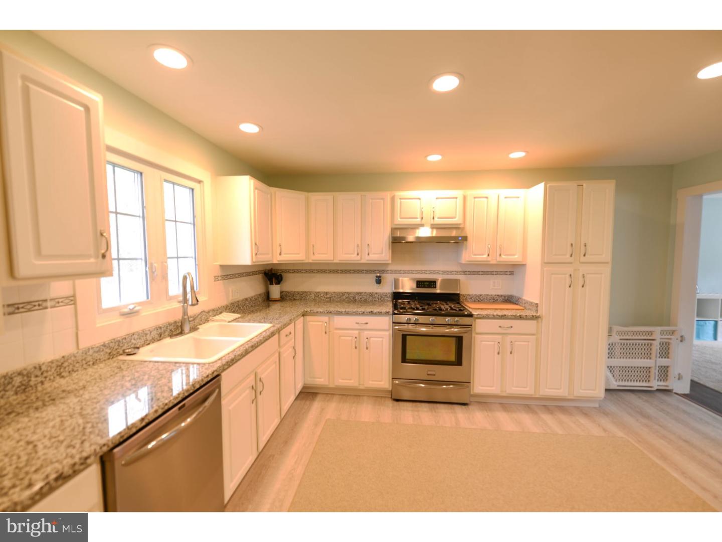 72 Kansas Road Pennsville, NJ 08070 - Photo 3 of 22 a kitchen with stainless steel appliances granite countertop a stove a sink and a refrigerator