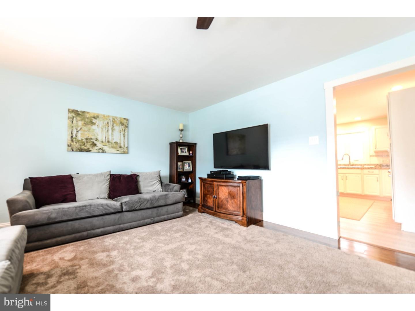 72 Kansas Road Pennsville, NJ 08070 - Photo 7 of 22 a living room with furniture and a flat screen tv