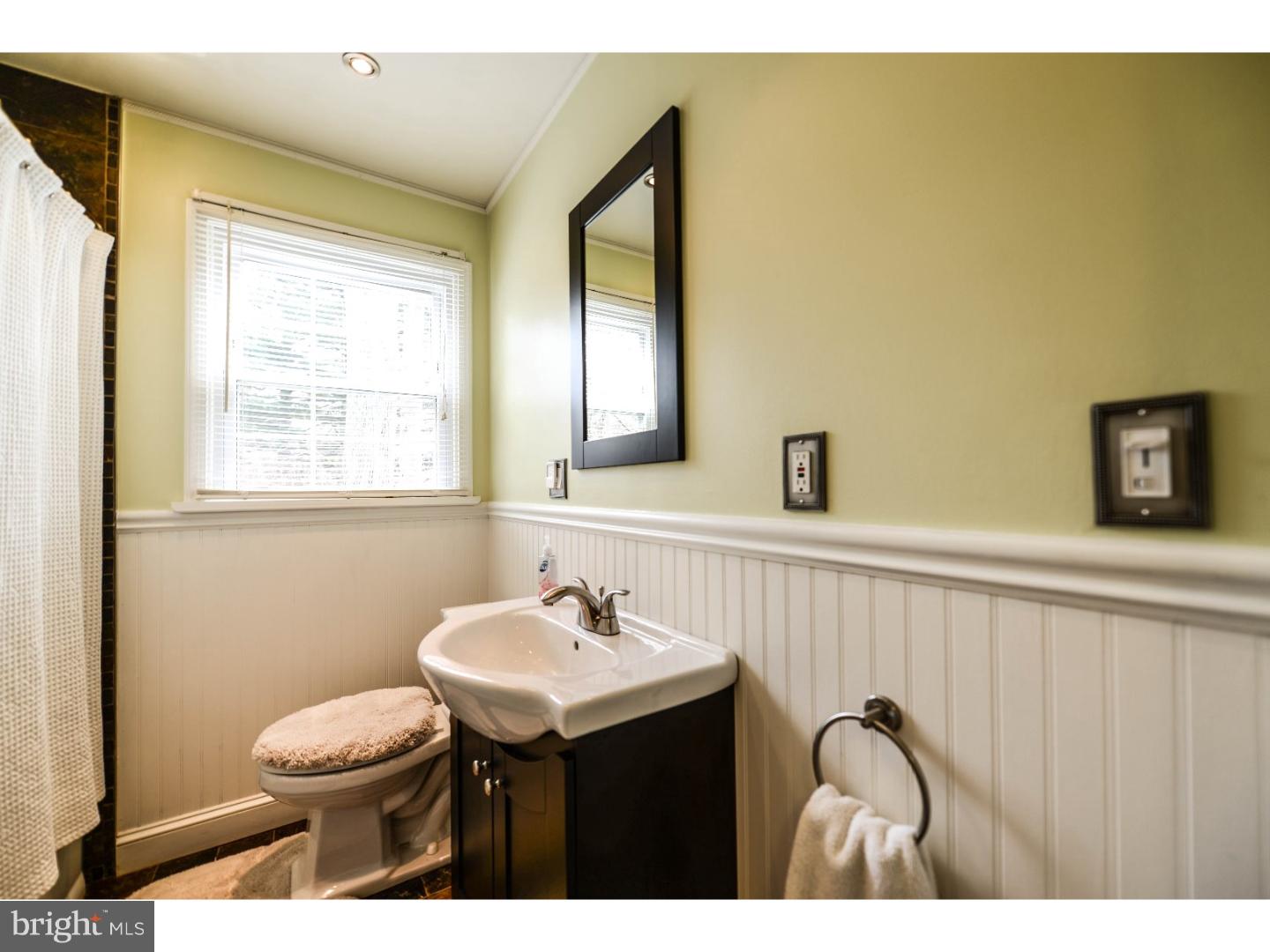 72 Kansas Road Pennsville, NJ 08070 - Photo 10 of 22 a bathroom with a sink vanity mirror and toilet