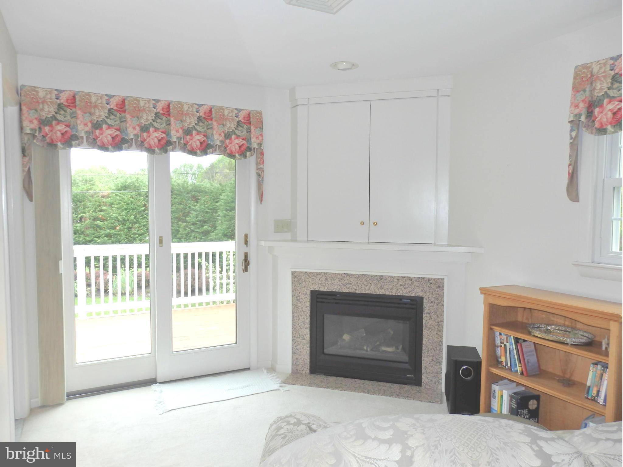 7940 Edgewood Farm Road Frederick, MD 21702 - Photo 12 of 30 Sitting area with fireplace and door to balcony