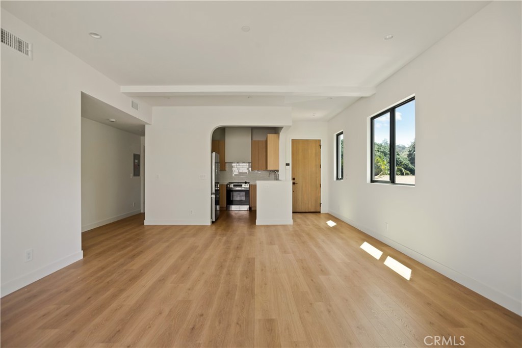 2671 1/2 Benedict Street Los Angeles, CA 90039 - Photo 18 of 39 a view of empty room with wooden floor and windows