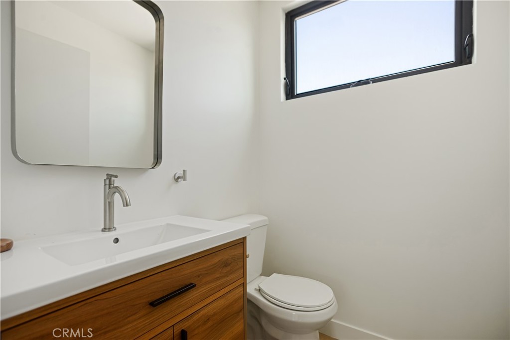 2671 1/2 Benedict Street Los Angeles, CA 90039 - Photo 22 of 39 a bathroom with a sink mirror and toilet