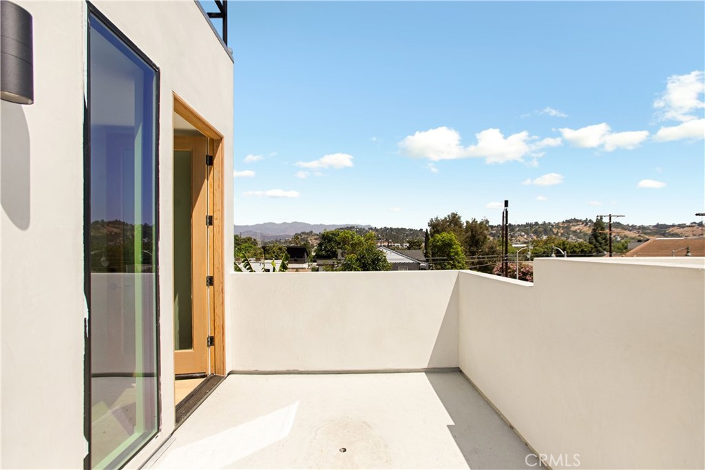 2671 1/2 Benedict Street Los Angeles, CA 90039 - Photo 25 of 39 a view of a terrace with sky view