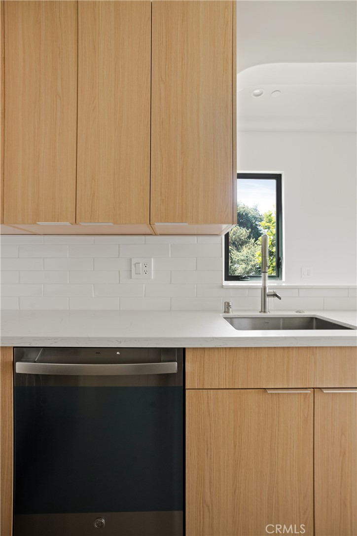 2671 1/2 Benedict Street Los Angeles, CA 90039 - Photo 27 of 39 a kitchen with a sink and cabinets