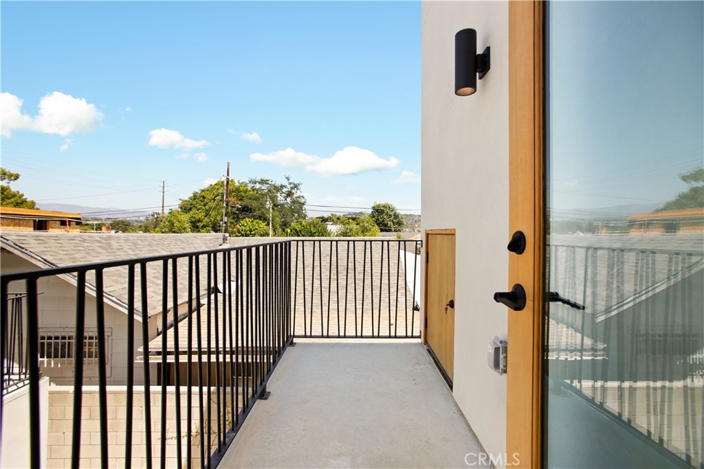 2671 1/2 Benedict Street Los Angeles, CA 90039 - Photo 3 of 39 a view of a balcony with wooden fence