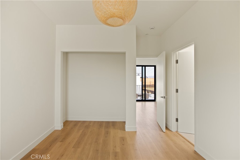 2671 1/2 Benedict Street Los Angeles, CA 90039 - Photo 37 of 39 wooden floor in an empty room