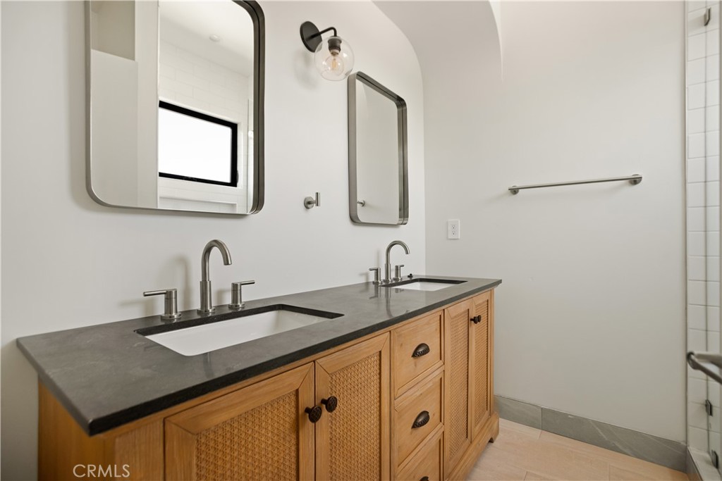 2671 1/2 Benedict Street Los Angeles, CA 90039 - Photo 7 of 39 a bathroom with a granite countertop sink and a mirror