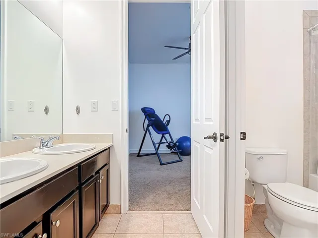 a view of bathroom with a sink and mirror