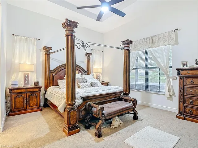 a bedroom with furniture and a window