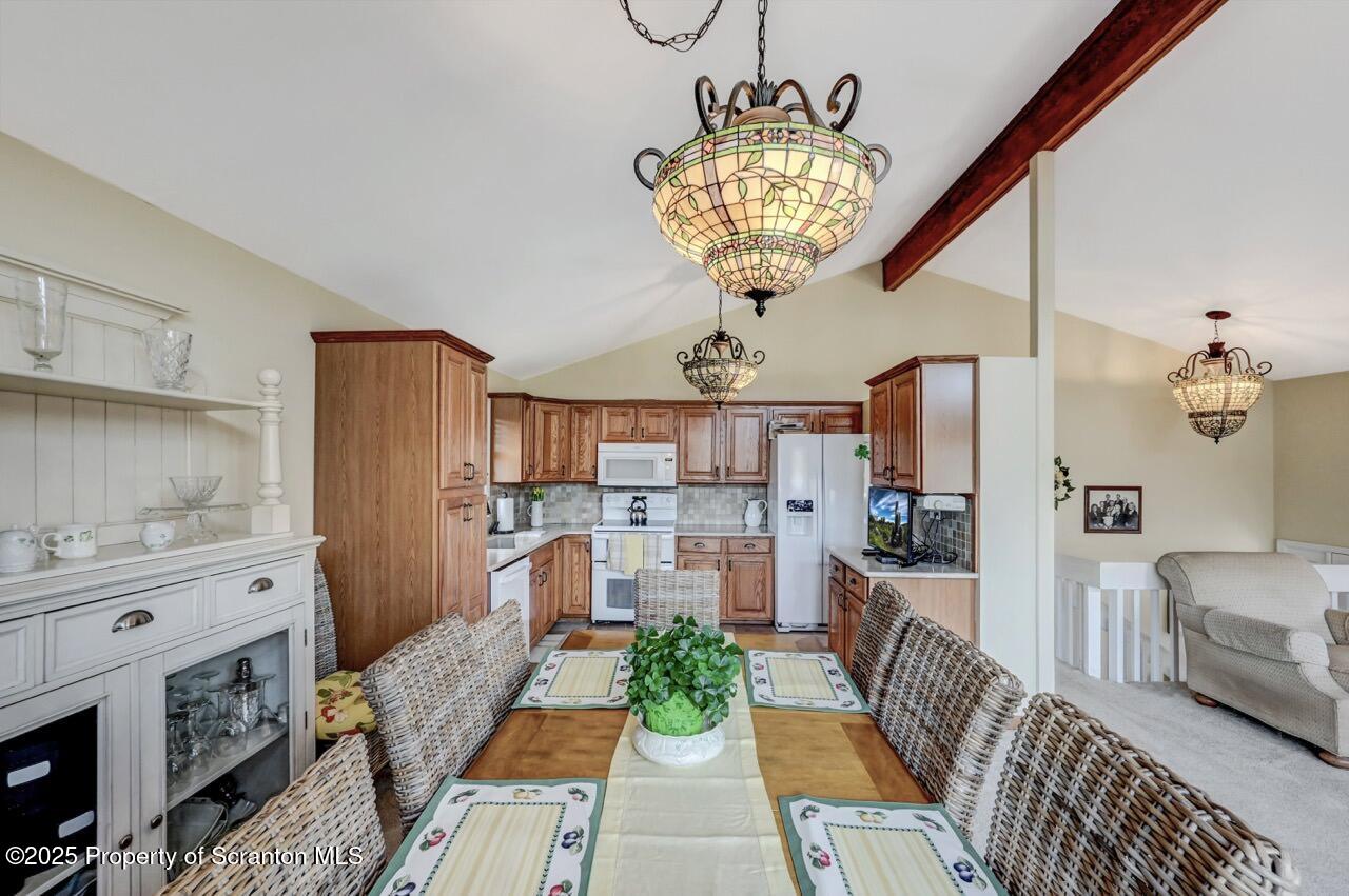 41 Show Kase Road Forest City, PA 18421 - Photo 18 of 81 a view of a livingroom with furniture a chandelier and wooden floor