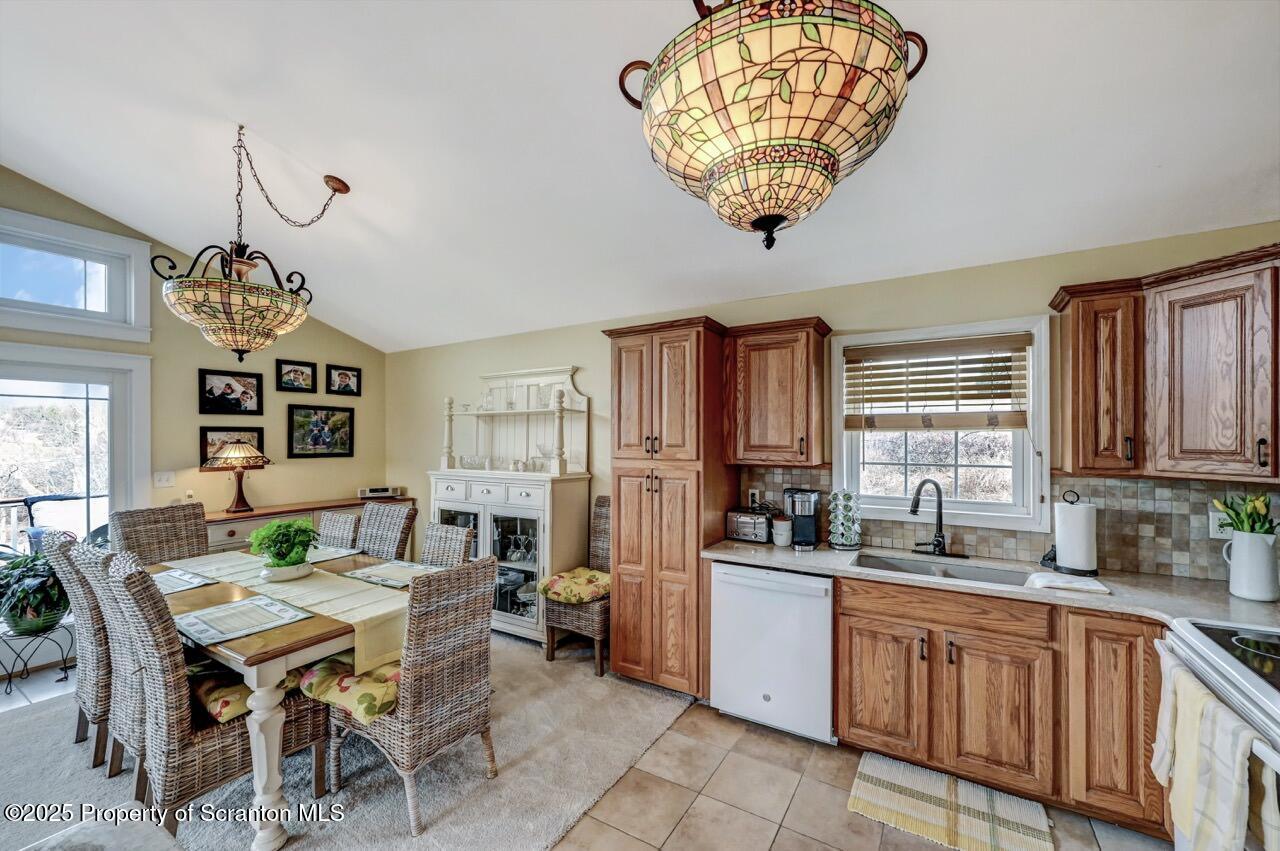 41 Show Kase Road Forest City, PA 18421 - Photo 25 of 81 a open dining room with furniture a window and a chandelier