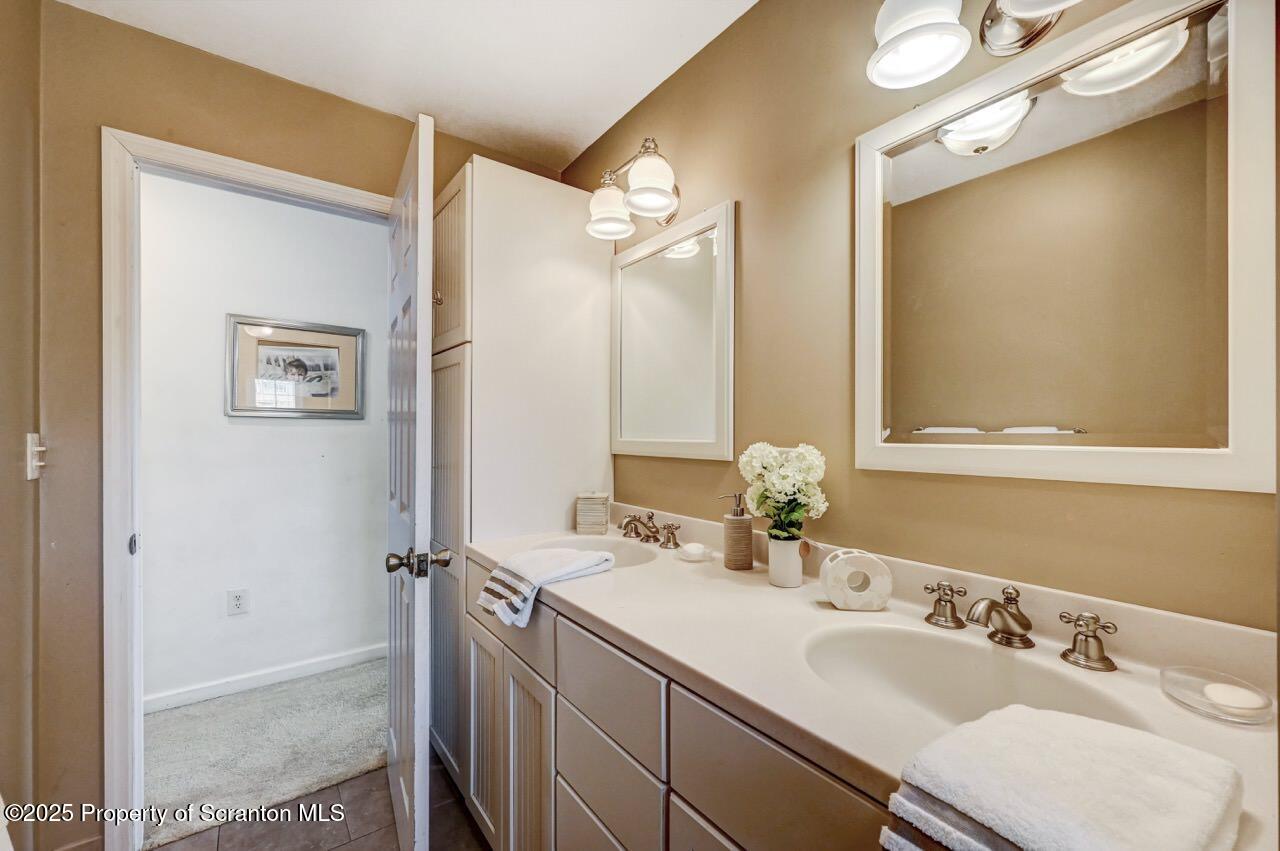 41 Show Kase Road Forest City, PA 18421 - Photo 34 of 81 a bathroom with a sink and a mirror