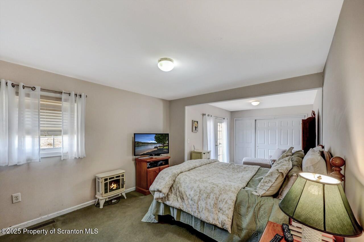 41 Show Kase Road Forest City, PA 18421 - Photo 46 of 81 a bed room with a bed and a television
