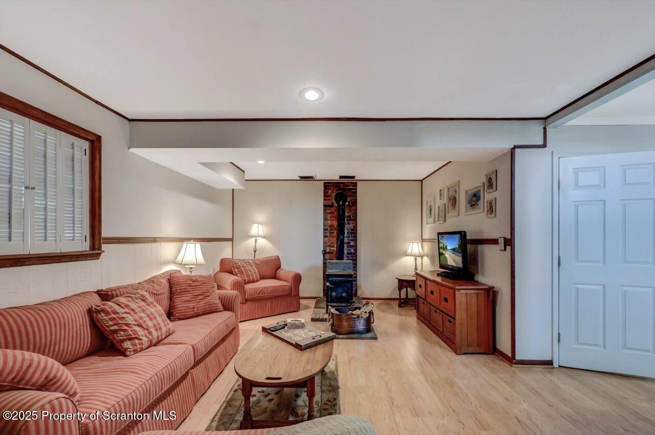 41 Show Kase Road Forest City, PA 18421 - Photo 60 of 81 a living room with furniture a ceiling fan and a wooden floor