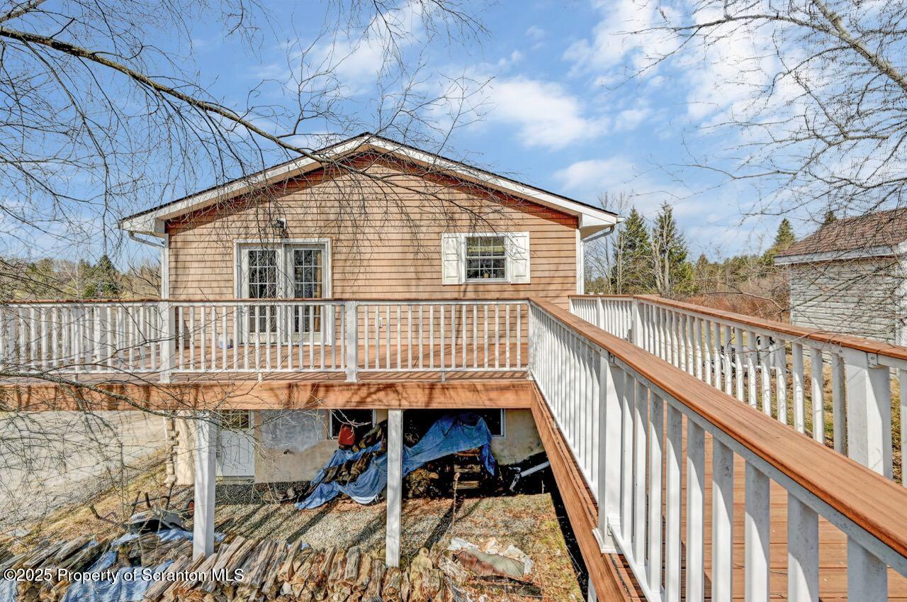 41 Show Kase Road Forest City, PA 18421 - Photo 76 of 81 a view of a house with a deck