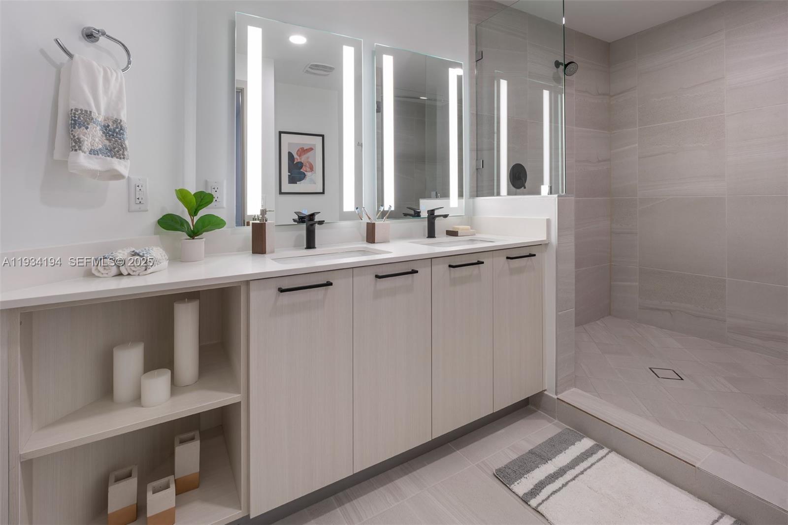 221 Southwest 12th Street, Unit 404 Miami, FL 33130 - Photo 20 of 31 a bathroom with a sink and a mirror