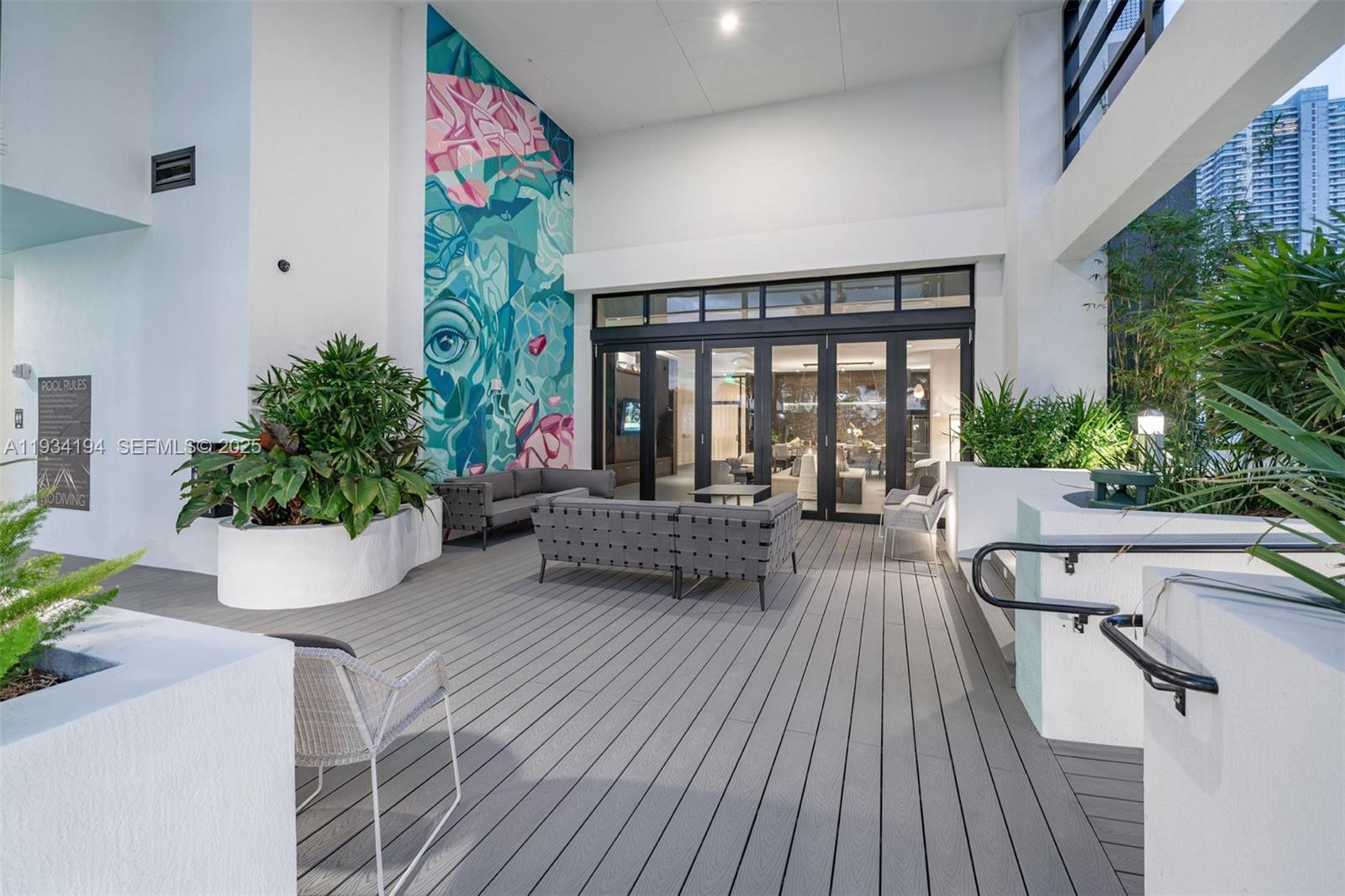 221 Southwest 12th Street, Unit 404 Miami, FL 33130 - Photo 29 of 31 a view of a patio with couches and potted plants