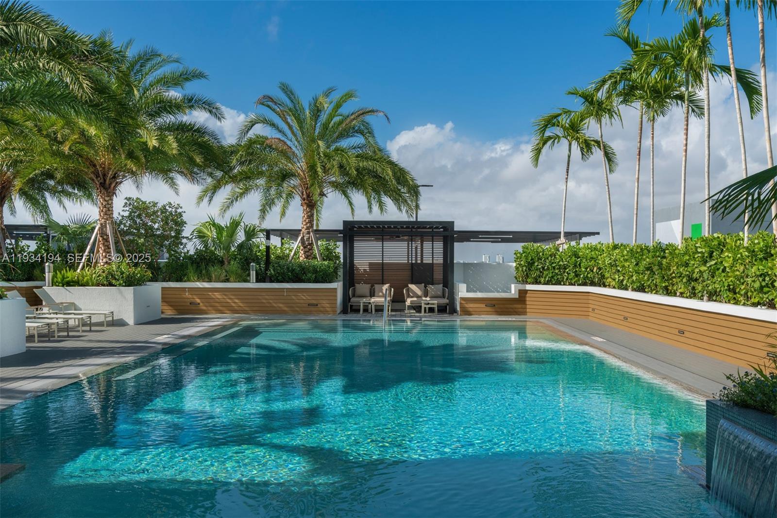 221 Southwest 12th Street, Unit 404 Miami, FL 33130 - Photo 4 of 31 a view of swimming pool with a table and chairs