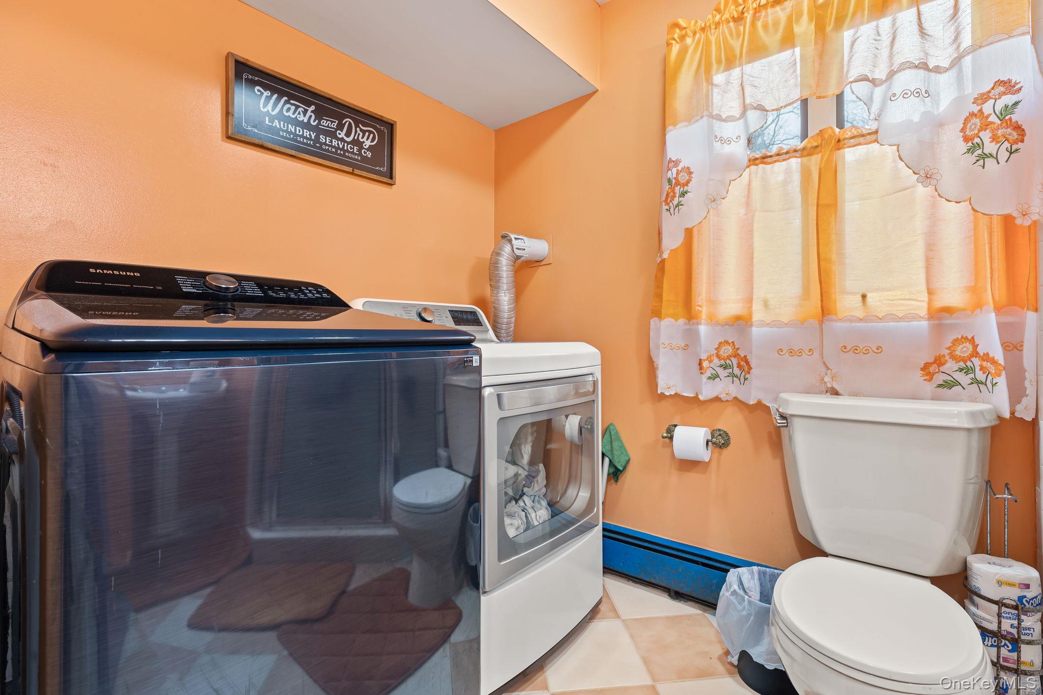 11 Cross Creek Road Cold Spring, NY 10516 - Photo 26 of 43 Half bathroom featuring toilet and washer and dryer