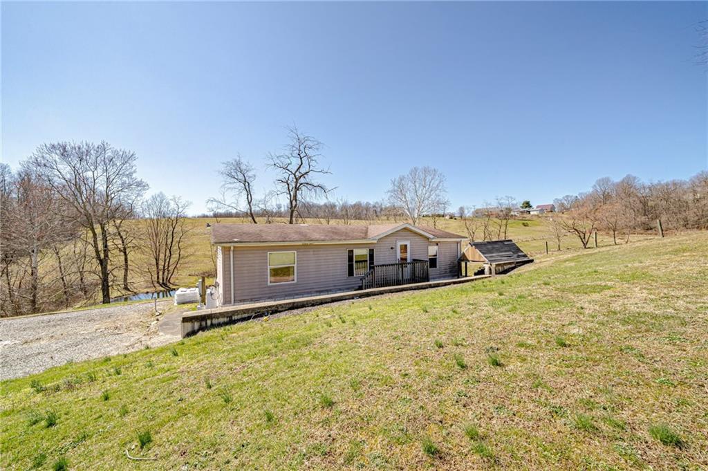 342 Little Summit Road Dunbar, PA 15431 - Photo 2 of 23 a front view of a house with a yard