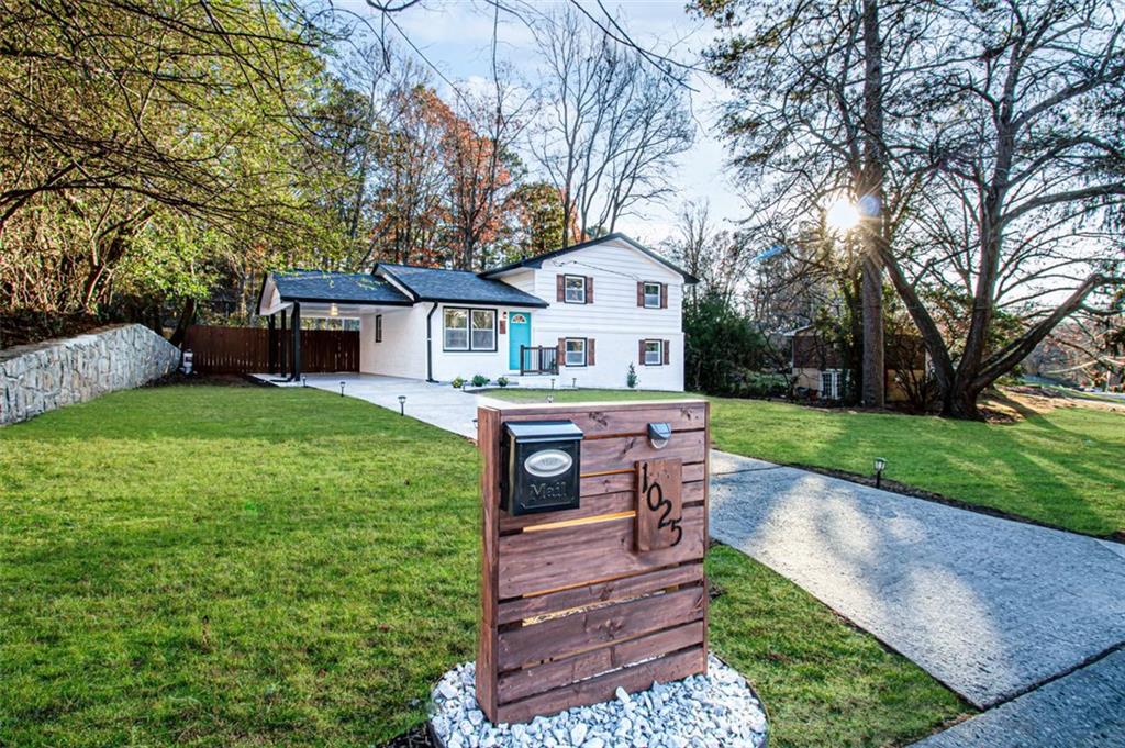 1025 Cone Road Forest Park, GA 30297 - Photo 1 of 1 a front view of a house with a yard table and trees