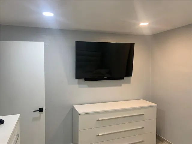 a room with a flat screen tv