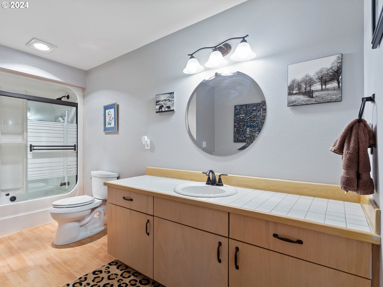 3300 Northeast 164th Street, Unit Q4 Ridgefield, WA 98642 - Photo 8 of 39 a bathroom with a sink and a mirror