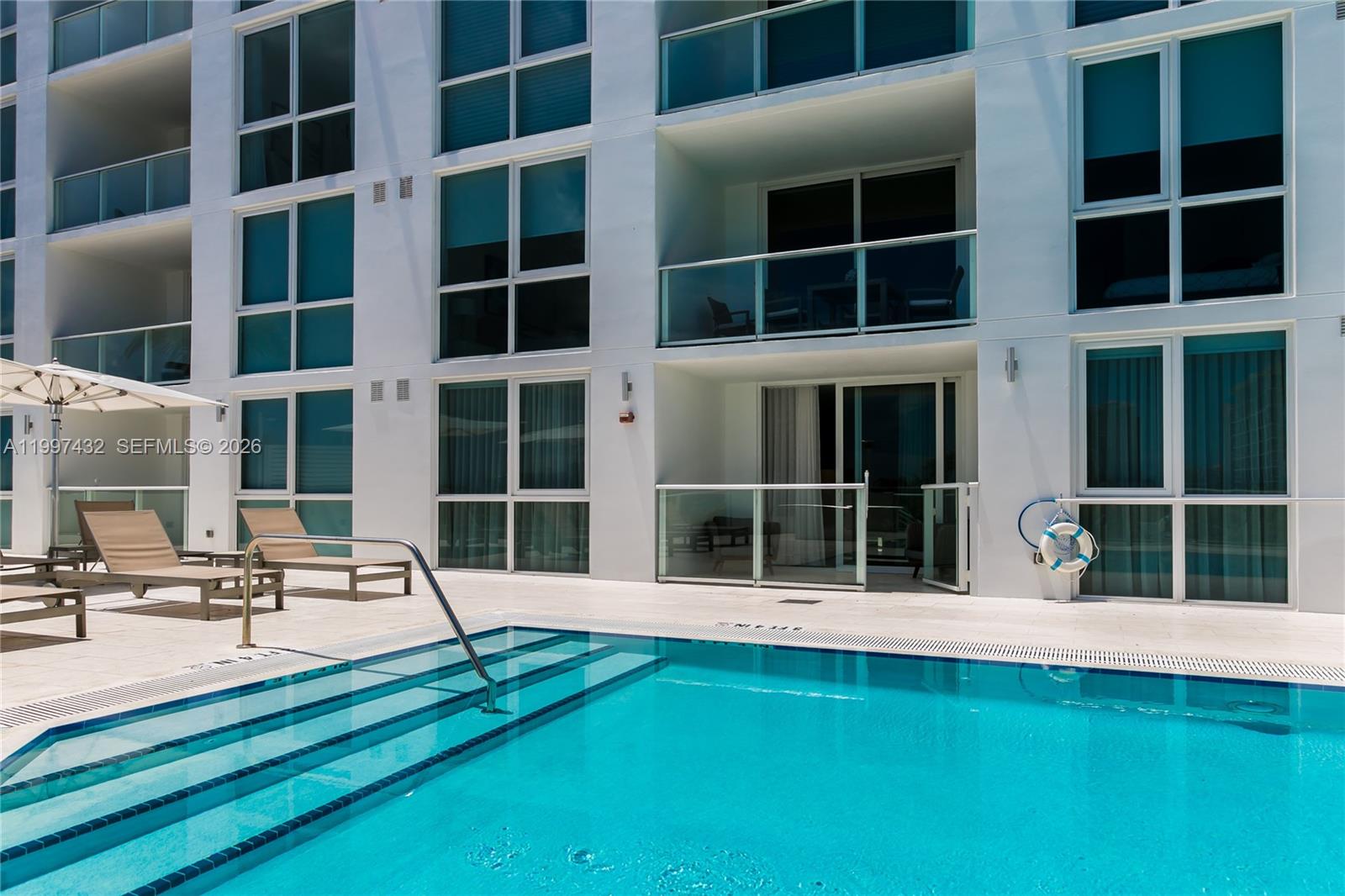 401 North Birch Road, Unit 404 Fort Lauderdale, FL 33304 - Photo 11 of 39 a house with pool in front of it