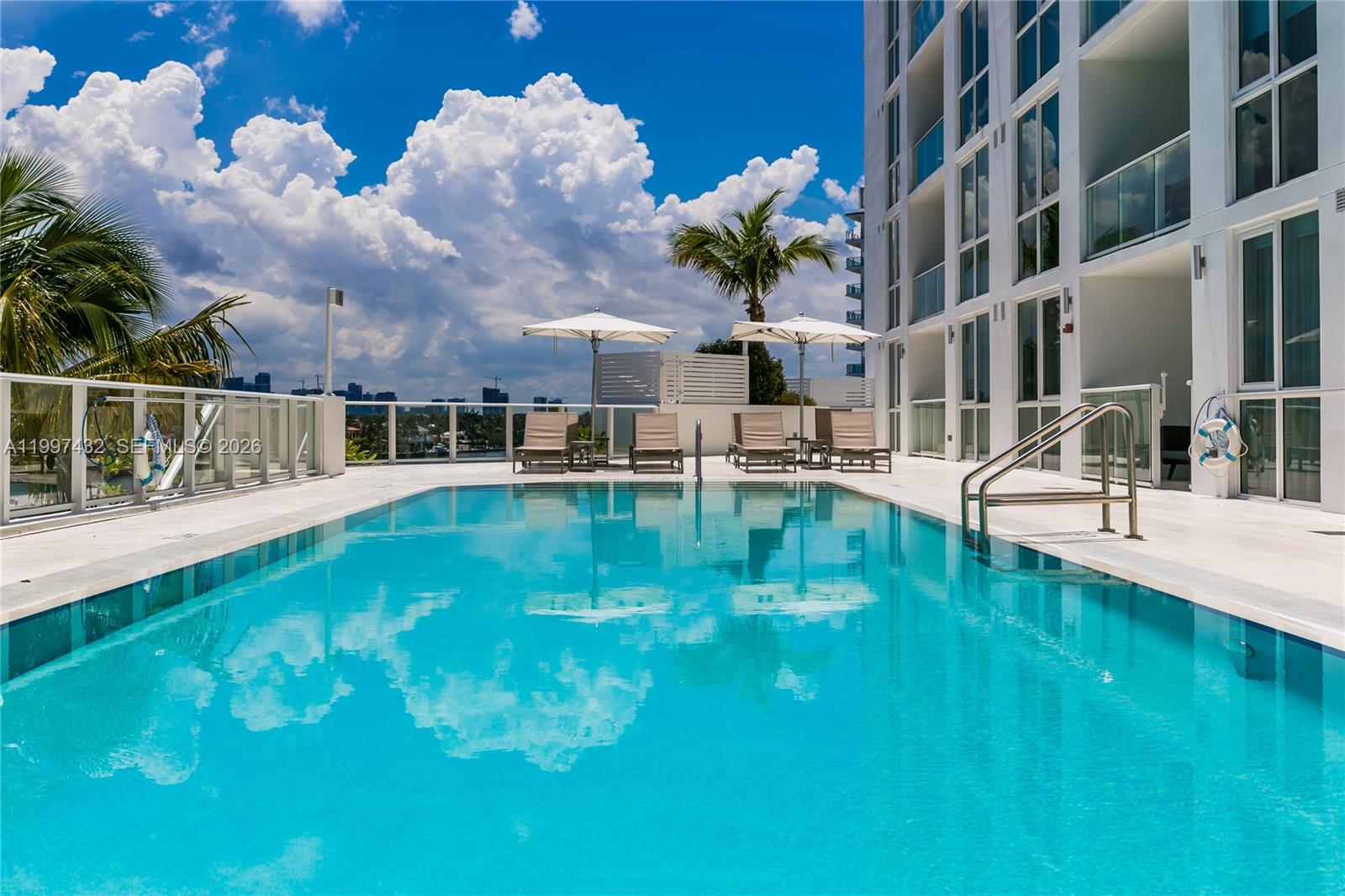 401 North Birch Road, Unit 404 Fort Lauderdale, FL 33304 - Photo 12 of 39 a view of a swimming pool with a garden