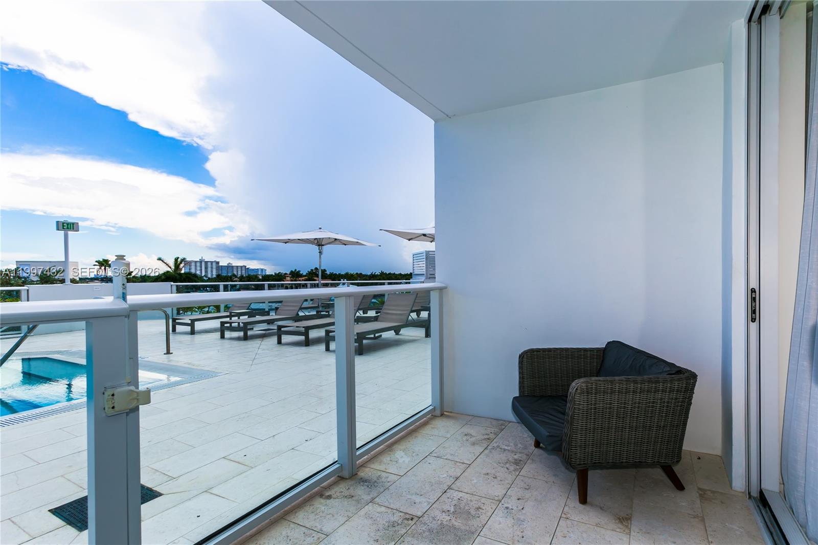 401 North Birch Road, Unit 404 Fort Lauderdale, FL 33304 - Photo 2 of 39 a kitchen with a table and chairs