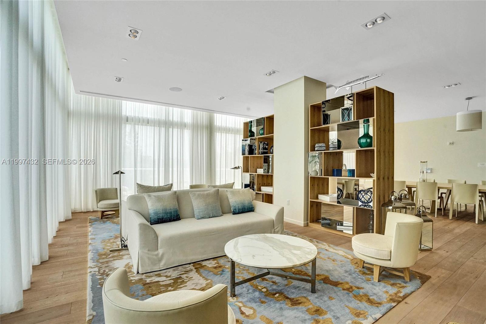 401 North Birch Road, Unit 404 Fort Lauderdale, FL 33304 - Photo 22 of 39 a living room with furniture and a large window