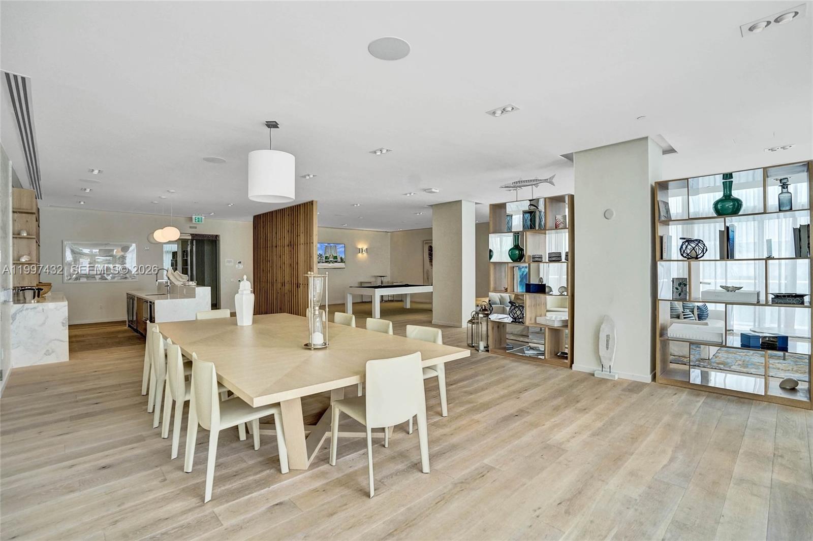 401 North Birch Road, Unit 404 Fort Lauderdale, FL 33304 - Photo 23 of 39 a view of a dining room with furniture and wooden floor