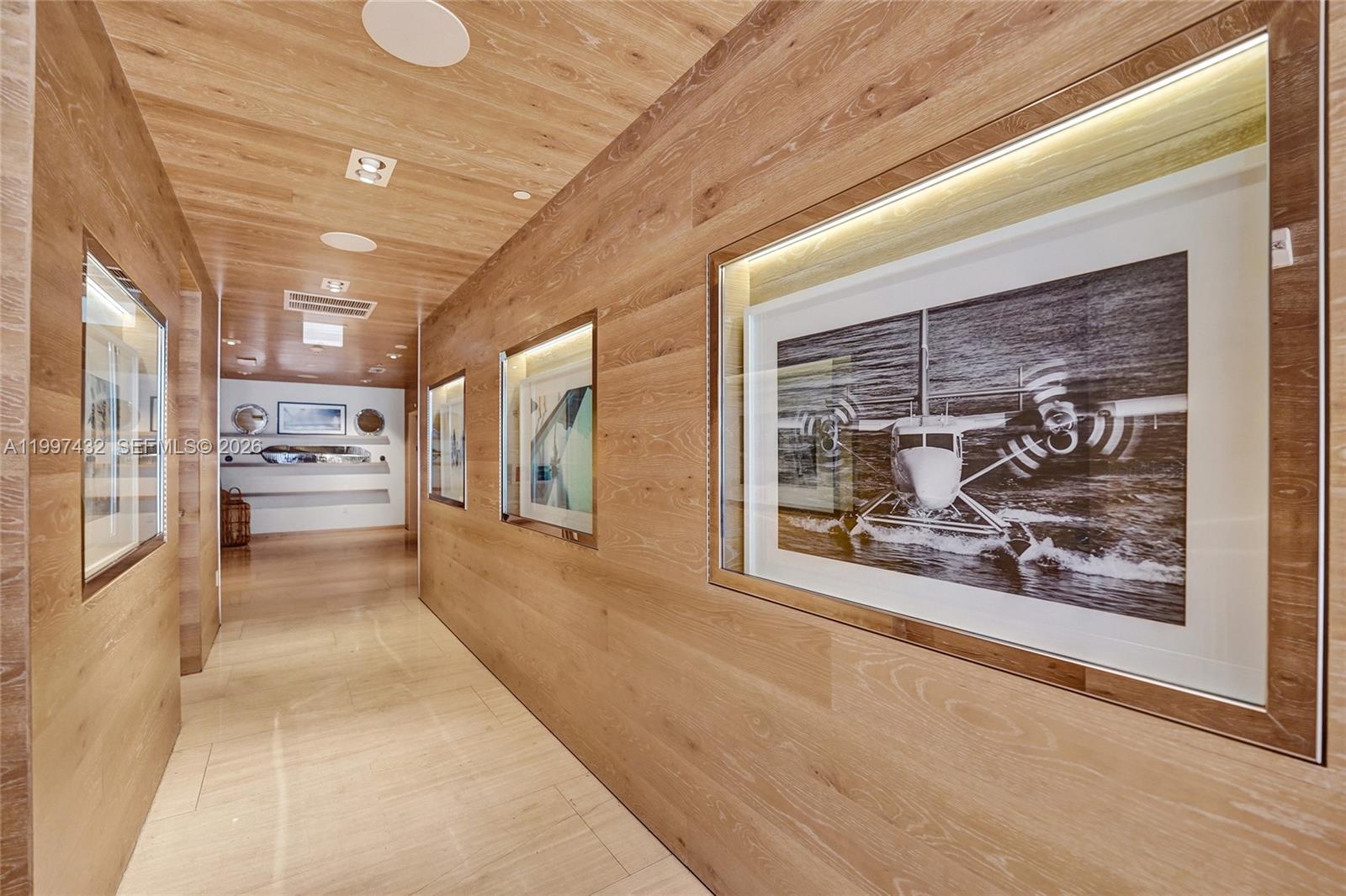 401 North Birch Road, Unit 404 Fort Lauderdale, FL 33304 - Photo 26 of 39 a view of a hallway with wooden floor