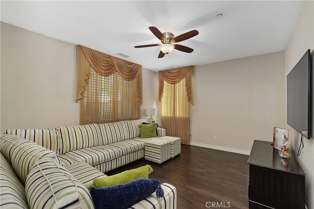 24128 Deputy Way Menifee, CA 92584 - Photo 14 of 34 a living room with furniture and a flat screen tv