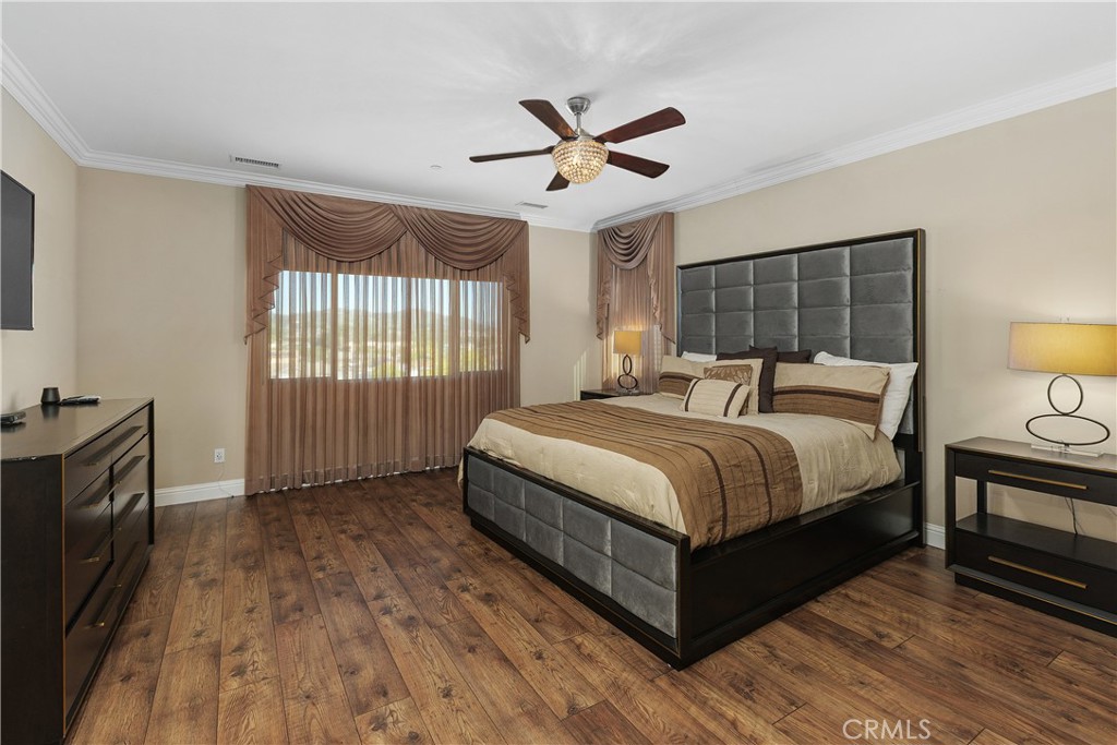 24128 Deputy Way Menifee, CA 92584 - Photo 18 of 34 a bedroom with a bed and window